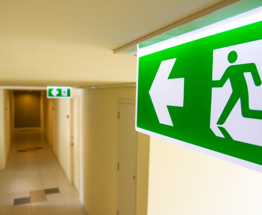 Fire,Exit,Sign,At,The,Corridor,In,Building